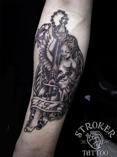天使と剣のタトゥー